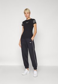 Mizuno ATHLETICS PANT - Treniņtērpa apakšdaļas - black