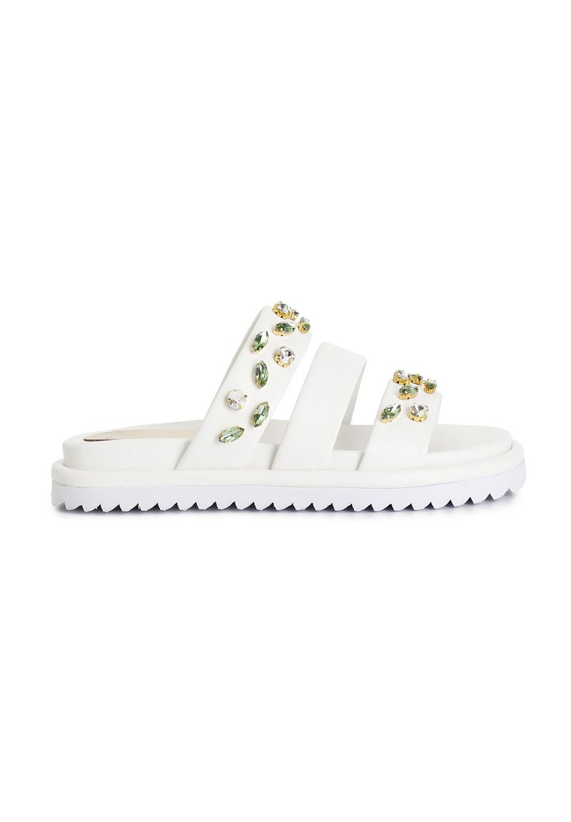 White slide sandal with three wide straps, adorned with multi-colored rhinestones, featuring a textured sole for grip.