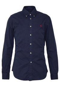 Mörkblå långärmad skjorta i knytning av bomull. Har en button-down krage, en framtida placket med silverknappar och en liten broderad logotyp.