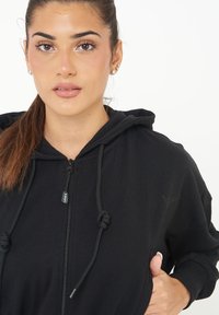 LEGEA TRIXY - Felpa con zip - nero