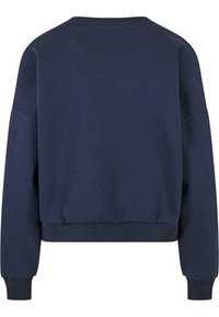 Námořnická modrá mikina s volným střihem, která má žebrovaný kulatý výstřih, dlouhé rukávy a žebrované manžety a spodní lem. Hladká textura, žádné vzory.