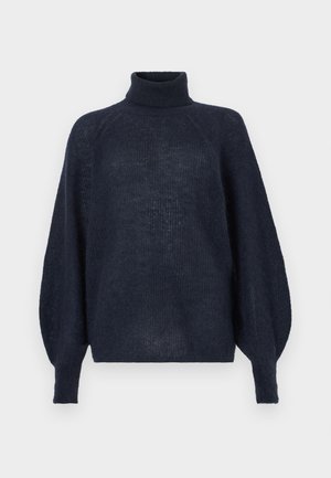 Jersey de cuello alto azul marino con un ajuste holgado, textura acanalada y mangas extragrandes, hecho de un material de punto suave y ligero.