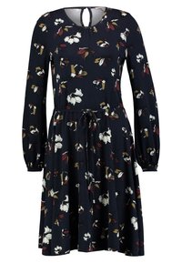 Robe marine à manches longues, motif floral en blanc, rouge et jaune. Dotée d'un col rond et d'une taille à cordon.