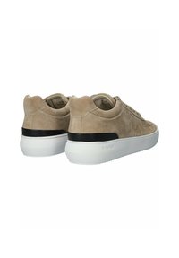 Light beige suede sneakers with a white sole and black accent on the heel, featuring a rounded design and classic lacing.