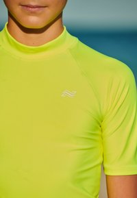 Next SHORT SLEEVE SUNSAFE  - Surfshirt - yellow