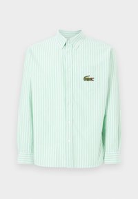 Light green and white striped button-up shirt, featuring a pocket with a green crocodile logo. Collared with long sleeves.
