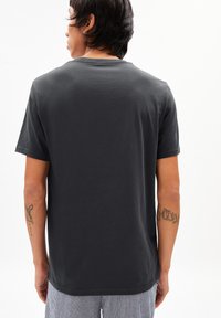 Dark gray short-sleeve t-shirt, cotton material, crew neck design, smooth texture, displays a plain back with visible stitching details.