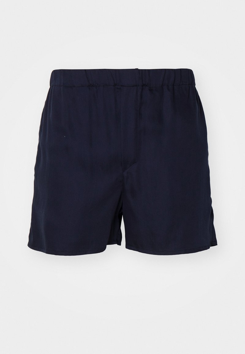 Pantalones cortos azul marino hechos de una tela suave con una cinturilla elástica. Presentan un diseño sencillo y una textura suave, sin patrones ni acentos visibles.