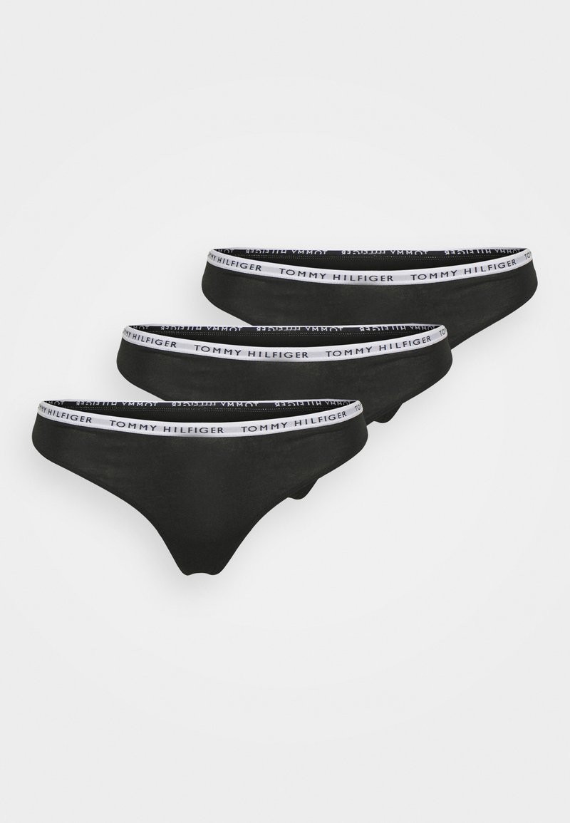 Slip en coton noir avec une taille blanche portant le logo "TOMMY HILFIGER". Comprend trois paires, design sans couture et taille moyenne.