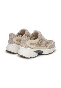 Beige sneakers with mesh and rhinestone detailing, cushioned white sole, rounded shape, and sturdy gray accents on the heel.