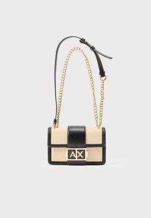 Beige and black crossbody bag with gold chain strap and black leather detail, featuring a gold "A|X" logo clasp on front flap.