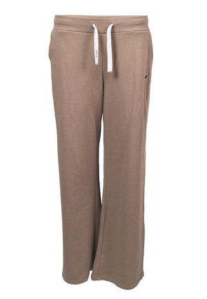 Pantalon de survêtement beige à jambes larges avec taille resserrée par un cordon blanc et petit emblème noir en forme de cœur sur la hanche droite.