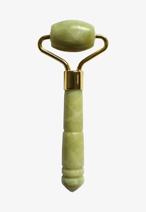 Green jade roller with a smooth oval stone head, gold metal accents, and a textured handle. Features a tapered end for precision use.