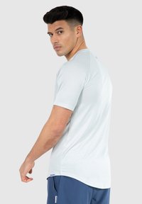 Smilodox POWERFIT TRIPLE PERFORMANCE - Camiseta deportiva - grau