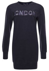 Navy collegepuserohelmi, jossa on pitkät hihat, ribattuja hihansuita ja helma, sekä teksturoitu "LONDON" -kirjonta rinnoissa. Valmistettu pehmeästä puuvillakankaasta.