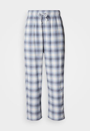 Rutete loungebukser i lys blått og hvitt. Laget av mykt stoff med elastisk midjebånd og snor. Casual passform, ankellengde design.
