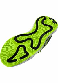 Semelle de chaussure présentant une couleur vert néon éclatant avec des lignes de contour noires, des motifs texturés et une semelle intermédiaire à pois blancs.