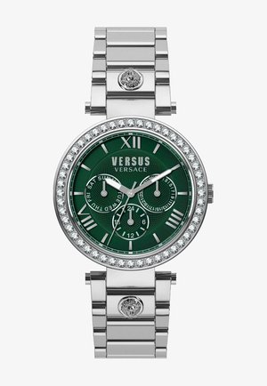 Silberfarbene Uhr mit grünem strukturiertem Zifferblatt, mit Kristallen besetzter Lünette, römischen Ziffern und Unterzifferblättern für Datum und Uhrzeit. Metallarmband.