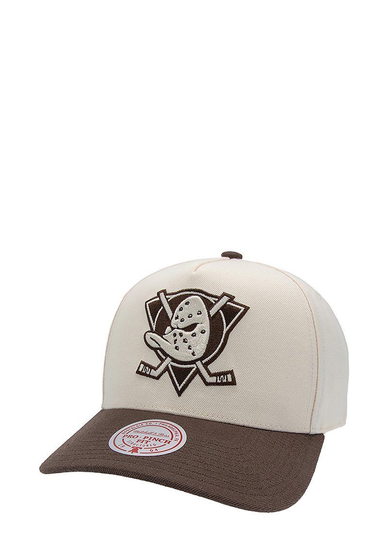 Beige baseball cap with a brown visor, featuring an embroidered logo of a cartoon duck and crossed hockey sticks on the front.