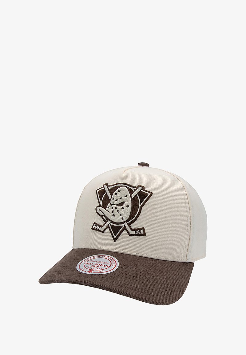 Beige baseball cap with a brown visor, featuring an embroidered logo of a cartoon duck and crossed hockey sticks on the front.