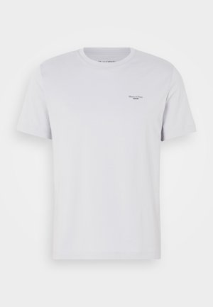 White cotton t-shirt with a crew neck, short sleeves, and a small black logo on the left chest. Smooth texture and standard fit.