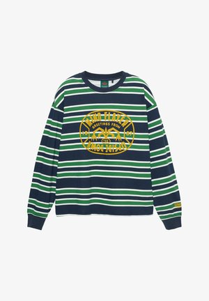 Hosszú ujjú pamut póló, sötétkék, zöld és fehér csíkokkal, sárga grafikával, amelyen a "greetings from" felirat szerepel. Normál fazonú, bordázott gallérral.