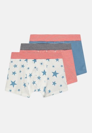 Three pairs of boys' boxers: one white with blue stars, one blue solid, and one navy with red stripes. All feature elastic waistbands.