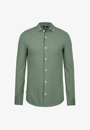 Chemise verte à manches longues en tissu texturé. Dispose d'un devant à boutons, d'un col classique et de boutons blancs.