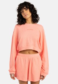 SUNNY - Tracksuit bottoms - peach tart