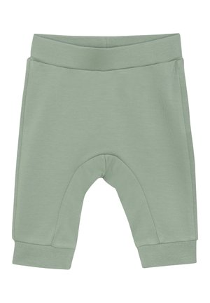Ljust gröna mjuka bomullsshorts med en ribbad midja, avsmalnande ben och en sömlös design vid knäet för komfort och rörlighet.