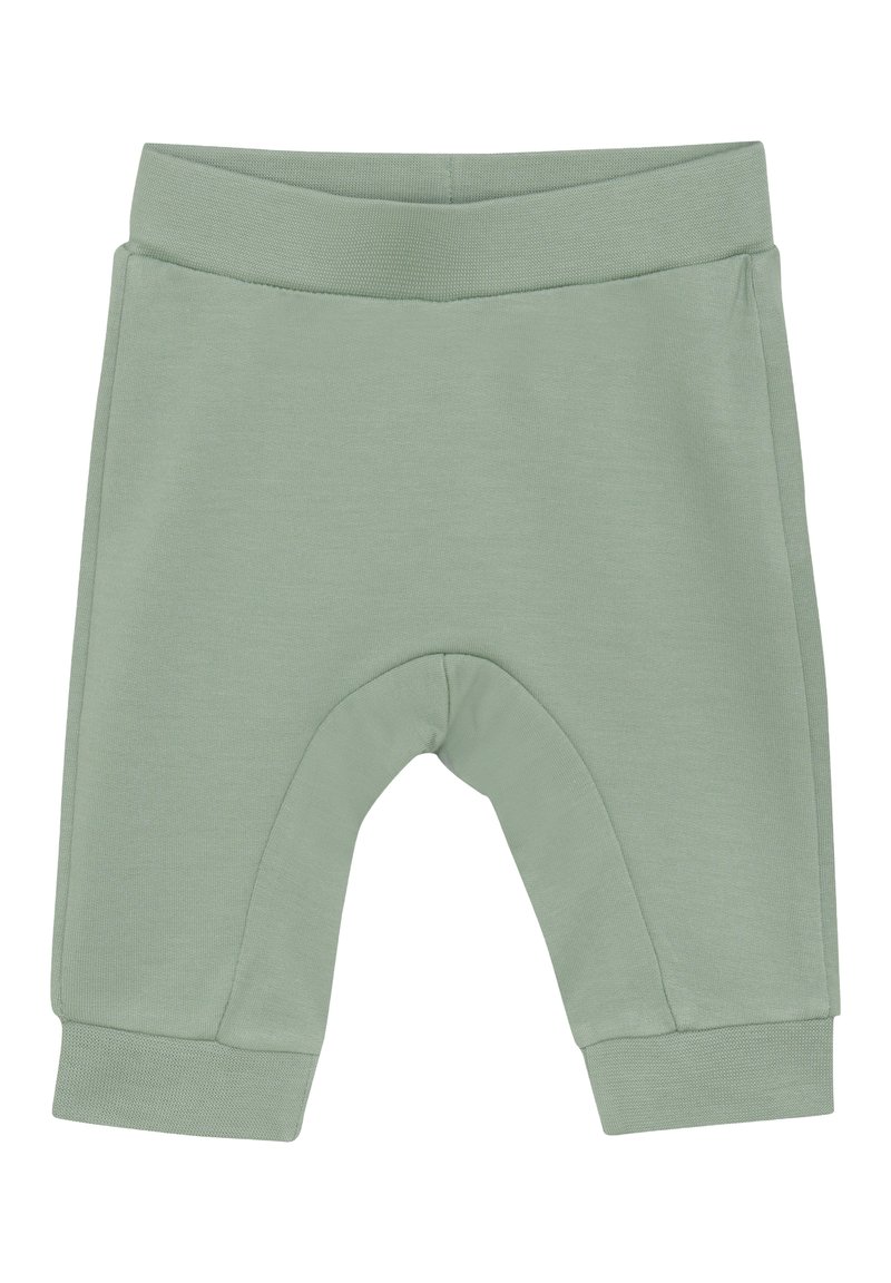 Ljust gröna mjuka bomullsshorts med en ribbad midja, avsmalnande ben och en sömlös design vid knäet för komfort och rörlighet.