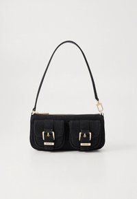 Black fabric handbag with gold hardware, two front pockets with buckle accents, zip closure, and a slim, adjustable shoulder strap.