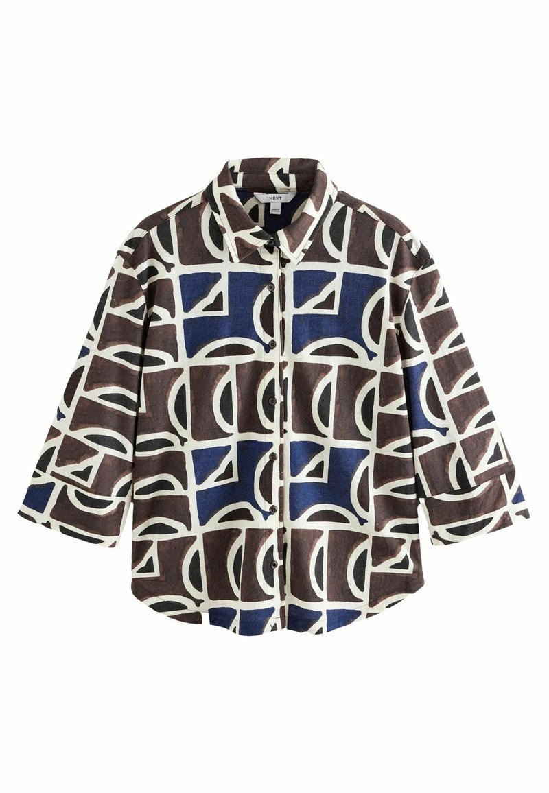Braunes und marineblau gemustertes Shirt mit kurzen Ärmeln, einem Kragen und Knopfverschluss. Besitzt abstrakte Formen auf einem cremefarbenen Hintergrund.