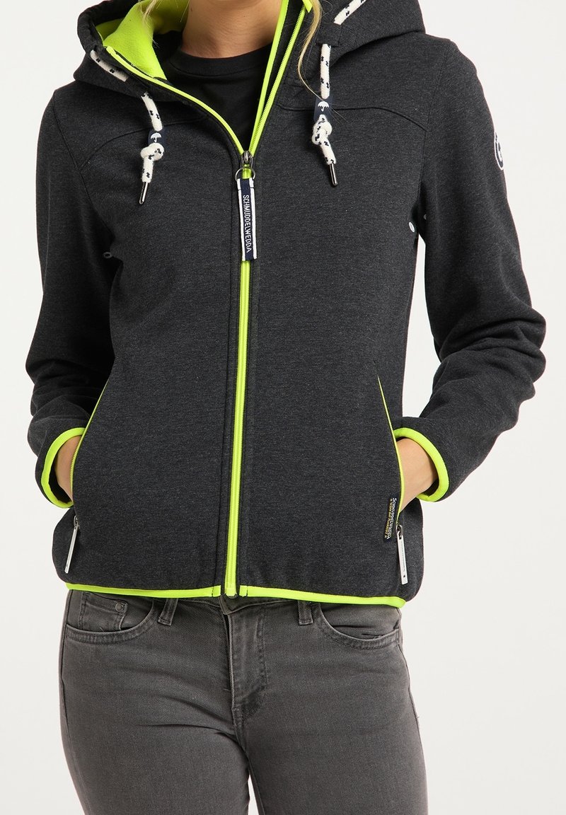 Mörkgrå zip-up-jacka med ett klart grönt foder, som har en huva, dekorativa snoddar och sidofickor. Slät tygtextur.