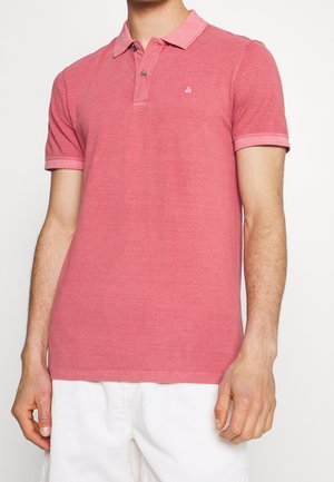 Red polo shirt made of soft cotton, featuring a collar, two buttons, and short sleeves. Subtle logo detail on the chest, plain design.