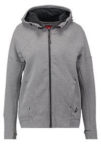 Šedá mikina na zip Nike s černou podšívkou kapuce, předními kapsami a otvory na palce na dlouhých rukávech.