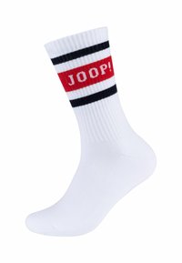 Hvide bomuldsstrømper med røde og sorte striber, der har teksten "JOOP!" i rød. Ribbet tekstur med en glat fodseng.