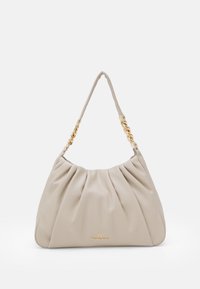 Beige handbag made of soft material with a pleated design, featuring a gold-tone chain handle and a logo embossed at the bottom.