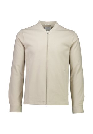 Beige zip-up jacket made of soft fabric, featuring a stand collar, long sleeves, and side pockets with a smooth texture.