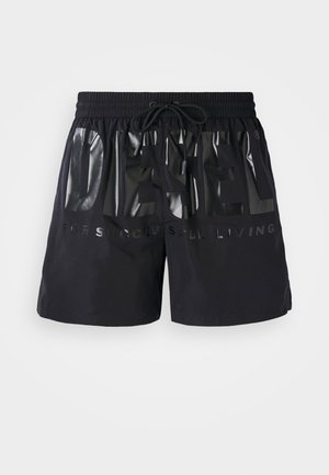 Shorts de bain noirs avec une ceinture élastique et un cordon de serrage. Présente un grand logo brillant "DIESEL" et le texte "POUR UNE VIE RÉUSSIE".