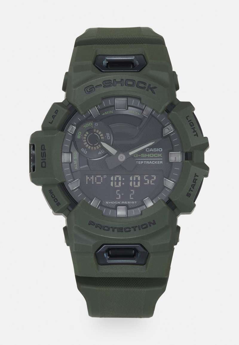 G-SHOCK digital klokke med et olivengrønt resinhus og -rem. Har en svart urskive, flere urvisere og sølv detaljer for tidsvisning.