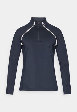 Pullover azul-marinho de manga longa com colarinho de meio zíper, apresentando riscas brancas nos ombros e uma textura de tecido suave e leve.