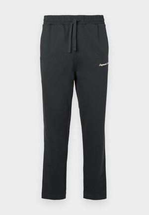 Svarta bomullsträningsbyxor med elastisk midja, dragsko och sidofickor. Har en liten broderad logotyp på vänster lår.