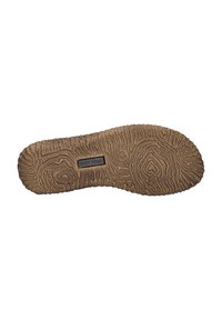 Suela de zapato de goma marrón con un patrón texturizado y ondulado, con una pequeña etiqueta rectangular del logo "JOSEF SEIBEL" exhibida de forma prominente.