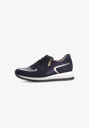 Navy blue sneaker with suede and metallic accents, lace-up design, side zipper, and a white and black textured rubber sole.