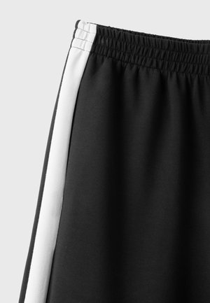 Stradivarius, SOFT-TOUCH WIDE-LEG JOGGER TROUSERS WITH SIDE BAND - Pantalon de survêtement - black