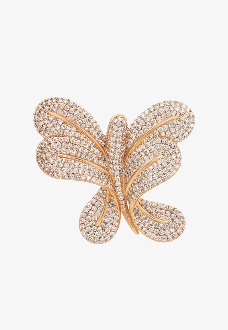 Zlatá brošňa v tvare motýľa ozdobená množstvom malých trblietavých bielych drahokamov na bielom pozadí.