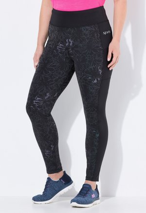 Schwarze Leggings mit floralem Muster, mit hochgeschnittener Taille und Seitentasche, aus dehnbarem Material für zusätzlichen Komfort.