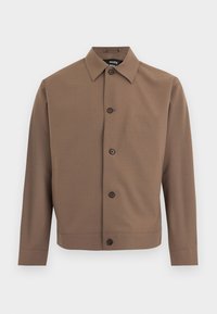 Καφέ σακάκι με κουμπιά, με μυτερό γιακά, μακριά μανίκια και τέσσερα σκοτεινά κουμπιά στο μπροστινό μέρος, πάνω σε λευκό φόντο.