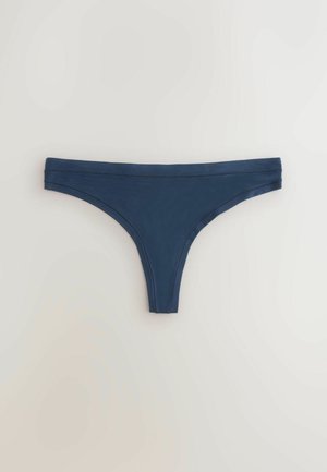 Marinblå trosa i mjukt tyg. Har en sömlös design med bred midjerem och minimal täckning.